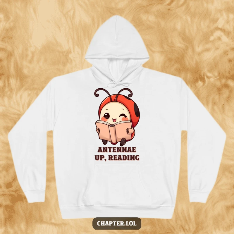 Funny Ladybug Hoodie: Soft and warm, featuring a cheerful ladybug with antennae serving as bookmarks, reading a tiny book.