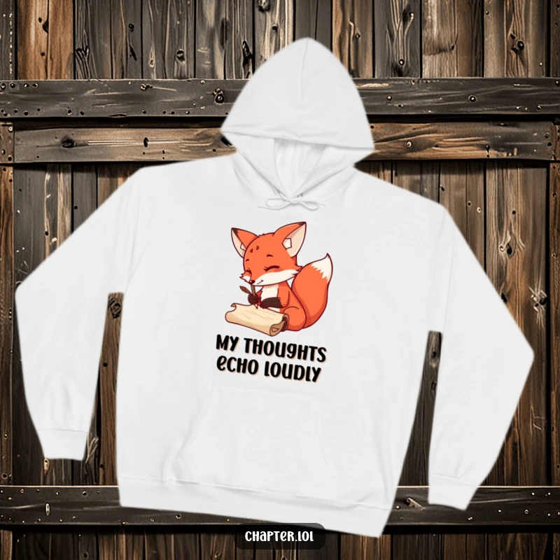 Funny Hoodie showcasing a sly red fox artistically scribbling with a quill pen on a scroll, emphasizing writer’s humor.