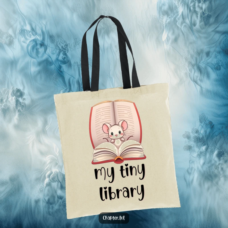 Funny tote bag with a tiny mouse peeking out of a large book, ideal for carrying literary treasures.